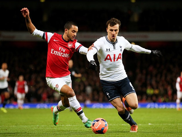 Arsenal's Theo Walcott and Tottenham's Vlad Chiriches in action during their FA Cup third round match on January 4, 2013