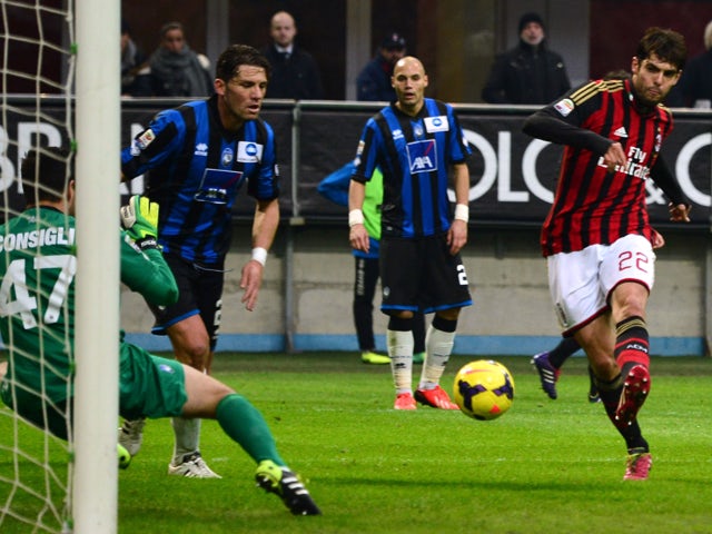 AC Milan's Brazilian forward Kaka kicks and score during the Serie A football match between AC Milan and Atalanta at San Siro Stadium in Milan on January 6, 2014