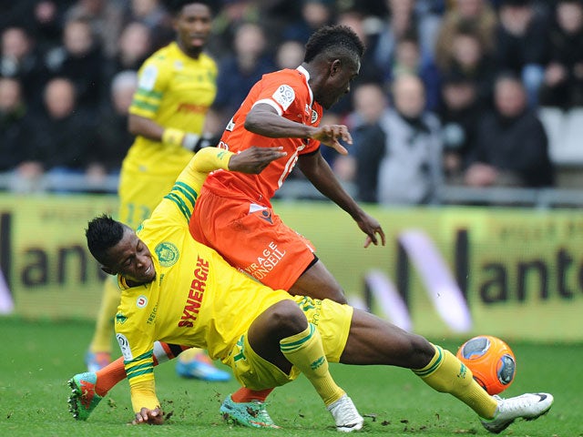 Lorient's Alain Traore and Nantes Birama Toure battle for the ball during their Ligue 1 match on January 12, 2014