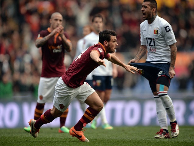 Roma's Alessandro Florenzi celebrates after scoring the opening goal against Genoa during their Serie A match on January 12, 2014