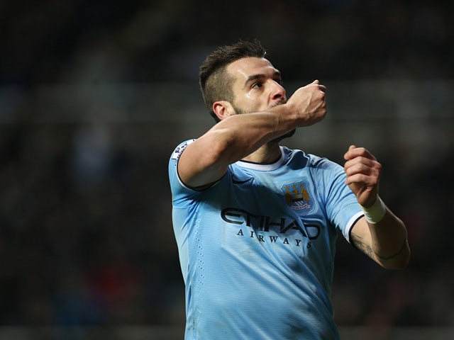 Man City's Alvaro Negredo celebrates after scoring his team's second goal against Newcastle during their Premier League match on January 12, 2014