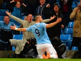 Alvaro Negredo of Manchester City celebrates scoring the opening goal during the Capital One Cup Semi-Final first leg match between against West Ham United on January 8, 2014