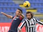 Cagliari's Andrea Cossu and Juventus' midfielder Andrea Pirlo battle for the ball during their Serie A match on January 12, 2014