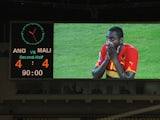 Angola's Zuela is shown on a big screen as he reacts to the 4-4 draw the Group A African Nations Cup match between Angola and Mali, at the November 11 Stadium on January 10, 2010