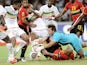 Angolan goalkeeper Carlos and his teammate Kali try to make save from Mali strikers Seydou Keita and Mamadou Bagayoko at the opening match of African Cup of Nations football championships CAN2010 between Angola and Mali at the November 11 stadium in Angol