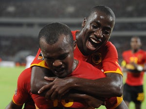 Angola's Flavio celebrates a goal with Djalma Campos during the Group A African Nations Cup match between Angola and Mali, at the November 11 Stadium on January 10, 2010