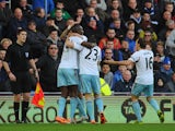 West Ham player Carlton Cole is congratulated after opening the scoring during the Barclays Premier League match between Cardiff City and West Ham United at Cardiff City Stadium on January 11, 2014