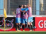 Players of Catania celebrate the opening goal during the Serie A match between Calcio Catania and Bologna FC at Stadio Angelo Massimino on January 6, 2014