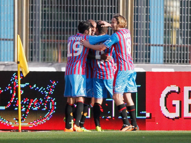 Players of Catania celebrate the opening goal during the Serie A match between Calcio Catania and Bologna FC at Stadio Angelo Massimino on January 6, 2014