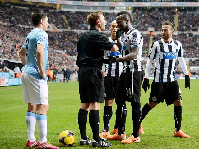 Newcastle's Cheik Tiote argues with referee Mike Jones after his goal is disallowed for offside against Manchester City during their Premier League match on January 12, 2014