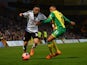 Chris David of Fulham battles with Josh Murphy of Norwich during the FA Cup sponsored by Budweiser Third Round match between Norwich City and Fulham at Carrow Road on January 4, 2014