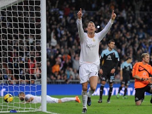Madrid keep pressure on top two with win