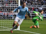 Manchester City's Edin Dzeko celebrates after scoring the opening goal against Newcastle during their Premier League match on January 12, 2014