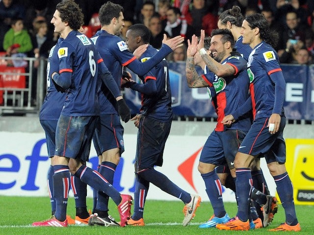Paris Saint-Germain's Argentine forward Ezequiel Lavezzi celebrates with teammates after scoring his team's fifth goal during the French League Cup football match against Brest on January 8, 2014