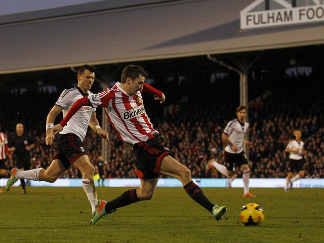 Sunderland's English midfielder Adam Johnson scores his second goal during the English Premier League football match between Fulham and Sunderland at Craven Cottage in London on January 11, 2014