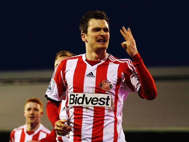 Adam Johnson of Sunderland celebrates scoring a hat trick during the Barclays Premier League match between Fulham and Sunderland at Craven Cottage on January 11, 2014