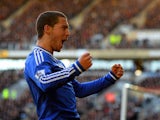 Eden Hazard of Chelsea celebrates scoring their first goal during the Barclays Premier League match between Hull City and Chelsea at KC Stadium on January 11, 2014