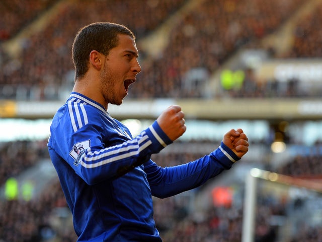 Eden Hazard of Chelsea celebrates scoring their first goal during the Barclays Premier League match between Hull City and Chelsea at KC Stadium on January 11, 2014
