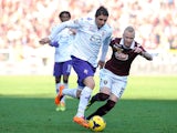 Fiorentina's Joaquin Sancez Rodriguez and Torino's Alexander Farnerud in action during their Serie A match on January 12, 2014