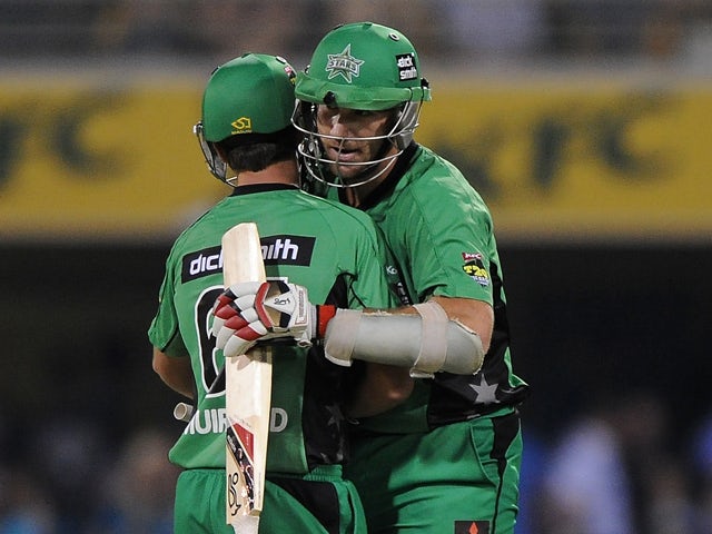 John Hastings of the Stars celebrates victory with James Muirhead during the Big Bash League match between Brisbane Heat and the Melbourne Stars at The Gabba on January 11, 2014