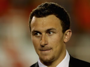 Quarterback Johnny Manziel of Texas A&M on the sideline during the 2014 Vizio BCS National Championship Game at the Rose Bowl on January 6, 2014