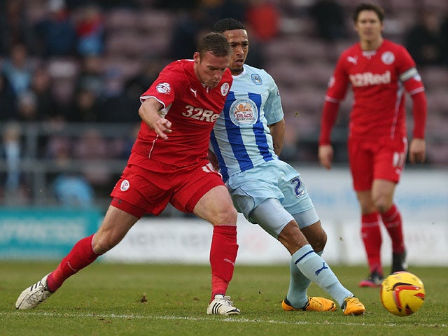 Coventry's Jordan Clarke and Crawley's Andy Drury in action during their League One match on January 12, 2014