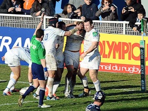 Leinster's Jordi Morphy is congratulated by teammates after scoring a try against Castres during their Heineken Cup match on January 12, 2014