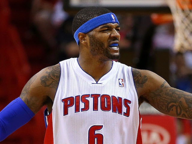Josh Smith of the Detroit Pistons reacts to a play during a game against the Miami Heat at American Airlines Arena on December 3, 2013 