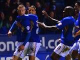 Jamie Vardy of Leicester celebrates scoring to make it 4-1 with team mates during the Sky Bet Championship match between Leicester City and Derby County at The King Power Stadium on January 10, 2014