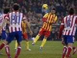 Barcelona's Argentinian forward Lionel Messi heads the ball during the Spanish league football match Club Atletico de Madrid vs FC Barcelona at the Vicente Calderon stadium in Madrid on January 11, 2014
