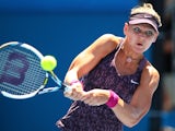 Lucie Safarova of the Czech Republic plays a backhand in her first round match against Francesca Schiavone of Italy during day two of the Sydney International at Sydney Olympic Park Tennis Centre on January 6, 2014 