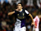 Liverpool's Luis Suarez celebrates after scoring his team's second goal against Stoke during their Premier League match on January 12, 2014