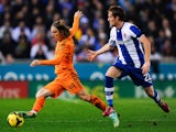 Luka Modric of Real Madrid CF duels for the ball with Alex of RCD Espanyol during the La Liga match on January 12, 2014