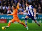 Luka Modric of Real Madrid CF duels for the ball with Alex of RCD Espanyol during the La Liga match on January 12, 2014