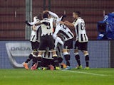 Udinese's Maicosuel is congratulated by teammates after scoring the opening goal against Inter Milan during their TIM Cup match on January 9, 2014