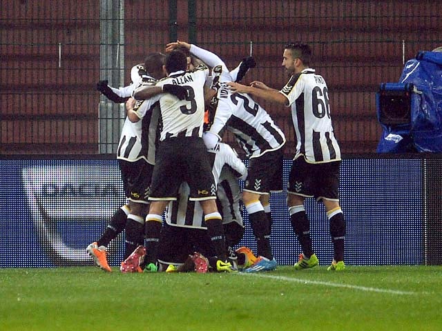 Udinese's Maicosuel is congratulated by teammates after scoring the opening goal against Inter Milan during their TIM Cup match on January 9, 2014