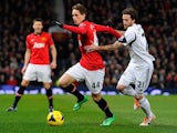 Manchester United's Belgian midfielder Adnan Januzaj vies with Swansea City's Spanish midfielder Jose Canas during the English Premier League football match between Manchester United and Swansea City at Old Trafford in Manchester, northwest England on Jan