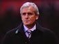 Stoke City manager Mark Hughes looks on prior to kick-off against Liverpool during their Premier League match on January 12, 2014