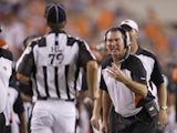 Cincinnati Bengals defensive coordinator Mike Zimmer argues with head linesman Kent Payne #79 during an NFL preseason game against the Indianapolis Colts at Paul Brown Stadium on September 1, 2011