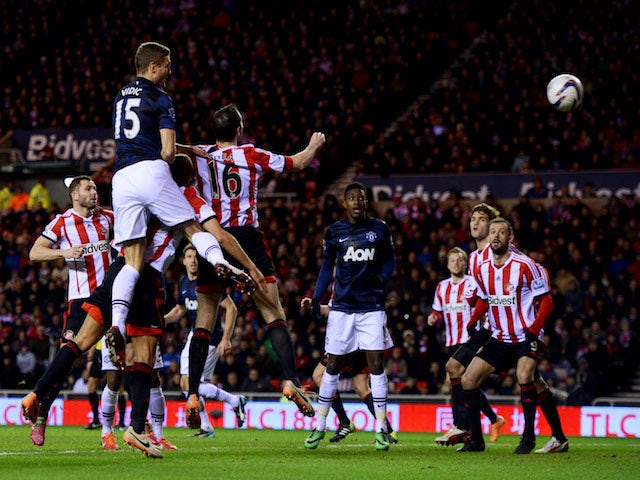 Nemanja Vidic of Manchester United scores their first goal with a header during the Capital One Cup Semi-Final, first leg match against Sunderland on January 7, 2014