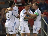Victory players celebrate a goal during the round 14 A-League match between the Newcastle Jets and Melbourne Victory at Hunter Stadium on January 10, 2014