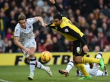 Troy Deeney of Watford has his shirt pulled by Paul Robinson Of Millwall FC during the Sky Bet Championship match between Watford and Millwall at Vicarage Road on December 26, 2013