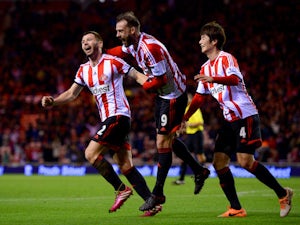 Phil Bardsley of Sunderland celebrates with team mates Steven Fletcher and Ki Sung-Yong after Manchester United's Ryan Giggs scores an own goal on January 7, 2014