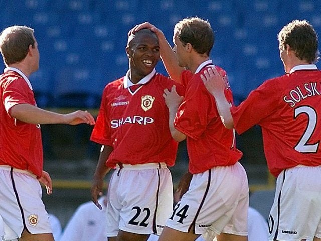 Quinton Fortune celebrates with his Manchester United teammates after scoring against South Melbourne on January 11, 2000.