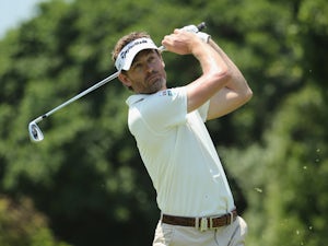 Jacquelin takes lead, McIlroy in contention