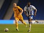 Rohan Ince of Brighton is challenged by Lee Minshull of Newport during the Capital One Cup First Round match between Brighton & Hove Albion and Newport County at Amex Stadium on August 6, 2013