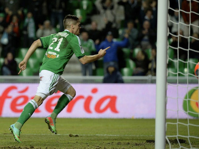 St Etienne's French midfielder Romain Hamouma reacts after scoring during the French Ligue 1 football match between Saint-Etienne (ASSE) and Evian TG on January 8, 2014