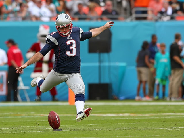 Stephen Gostkowski #3 of the New England Patriots kicks off during a game against the Miami Dolphins at Sun Life Stadium on December 15, 2013