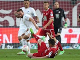 Hoffenheim's Tobias Weis and Kaiserslautern's Ariel Borysiuk vie for the ball during the German first and second Bundesliga Relegation football match 1. FC Kaiserslautern vs. TSG 1899 Hoffenheim in Kaiserslautern, Germany, on May 27, 2013