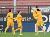 Luca Toni of Hellas Verona FC celebrates with his team-mates after scoring the opening goal during the Serie A match between Udinese Calcio and Hellas Verona FC at Stadio Friuli on January 6, 2014